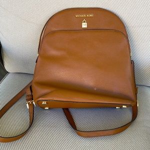 Great backpack. Amazing leather. One small spot in front. Smoke free home